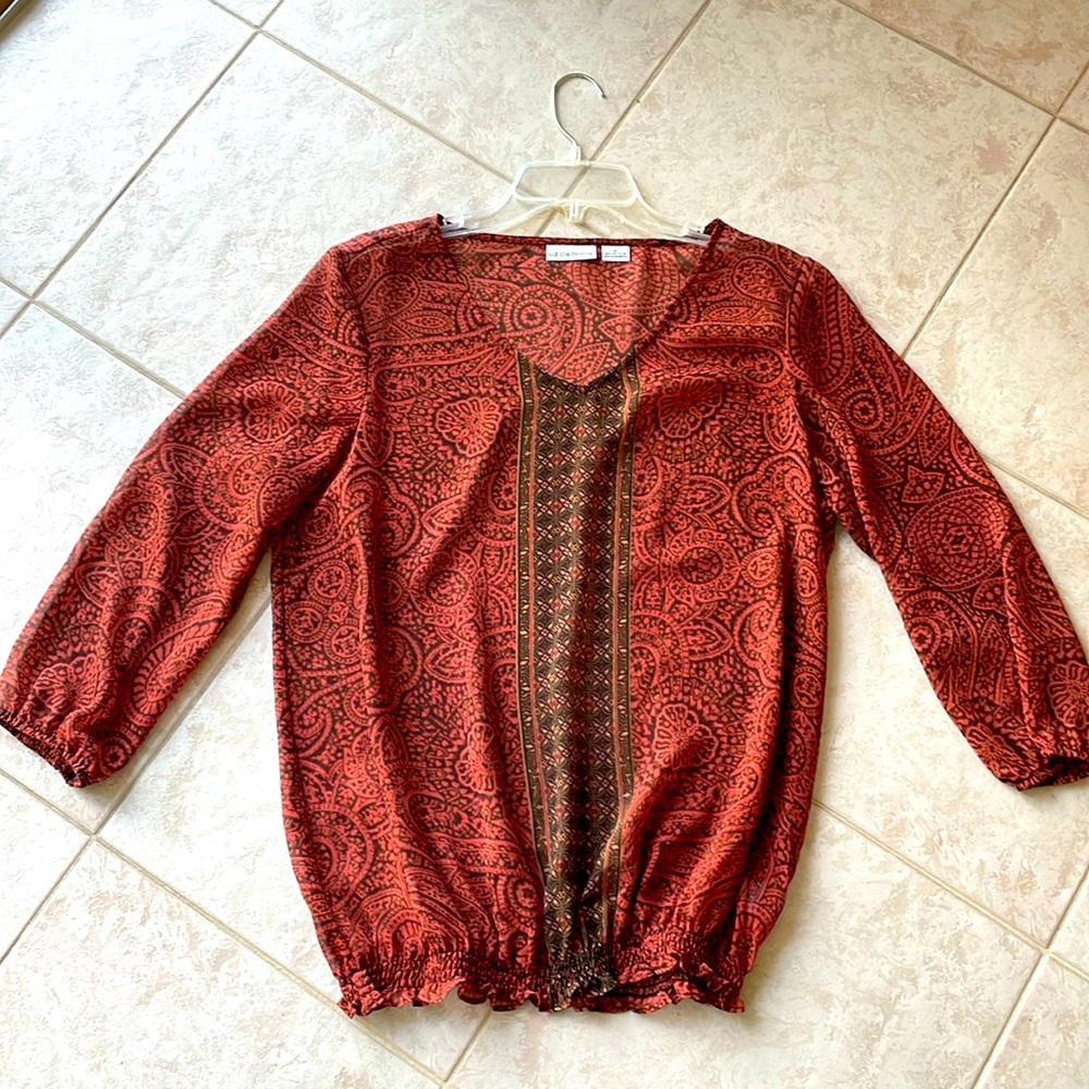 Sheer blouse size Medium but could fit large , elastic at bottom